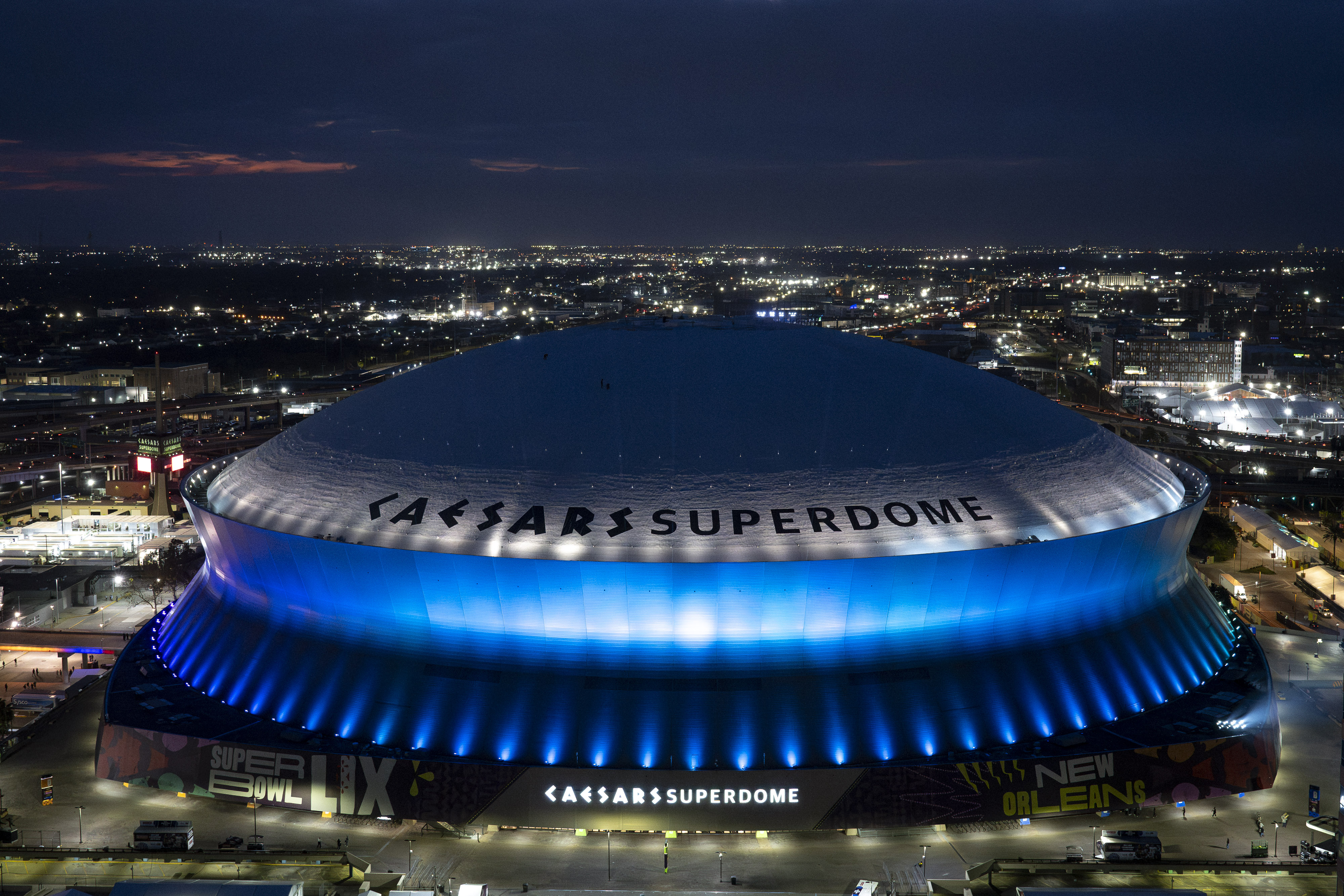 Caesars Superdome aerial at night before Super Bowl LIX, New Orleans
