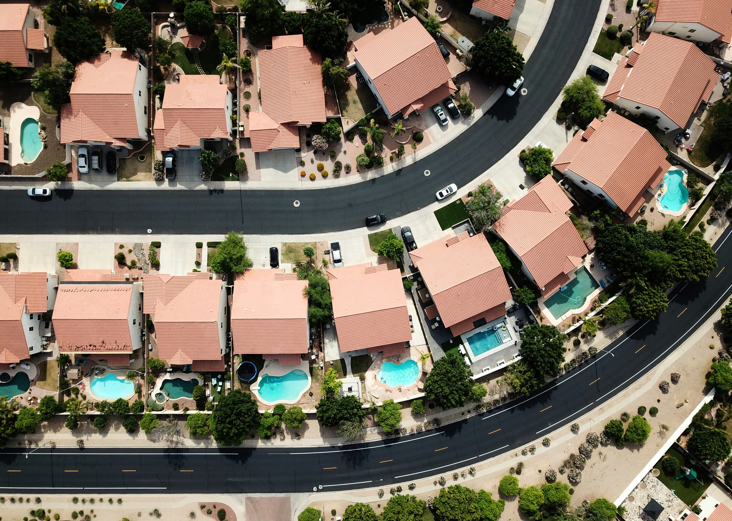 A gallery image from Housing: Aerial View Of Homes With Pools In Suburb Glendale, Arizona