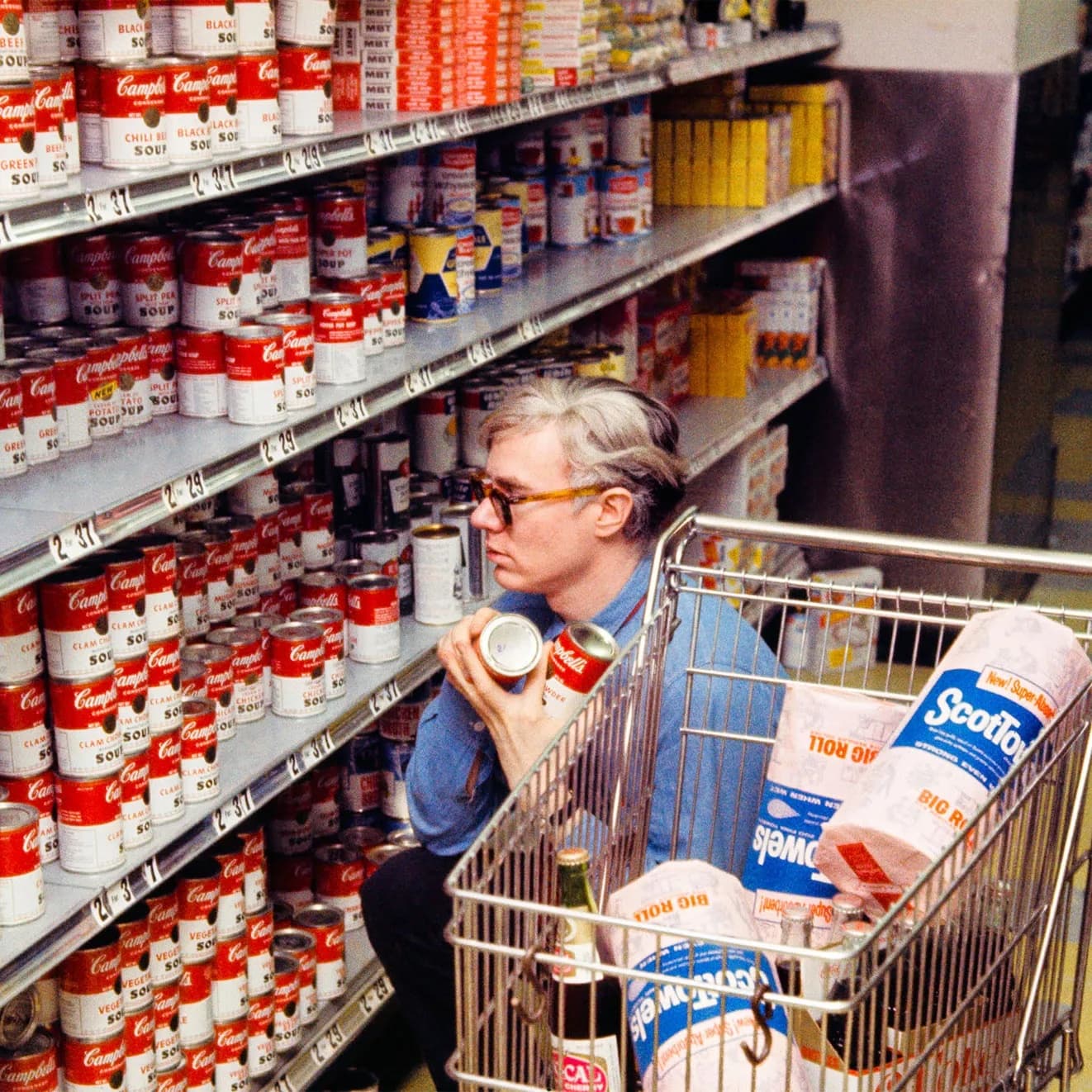 The pop-art icon beside his most famous work.