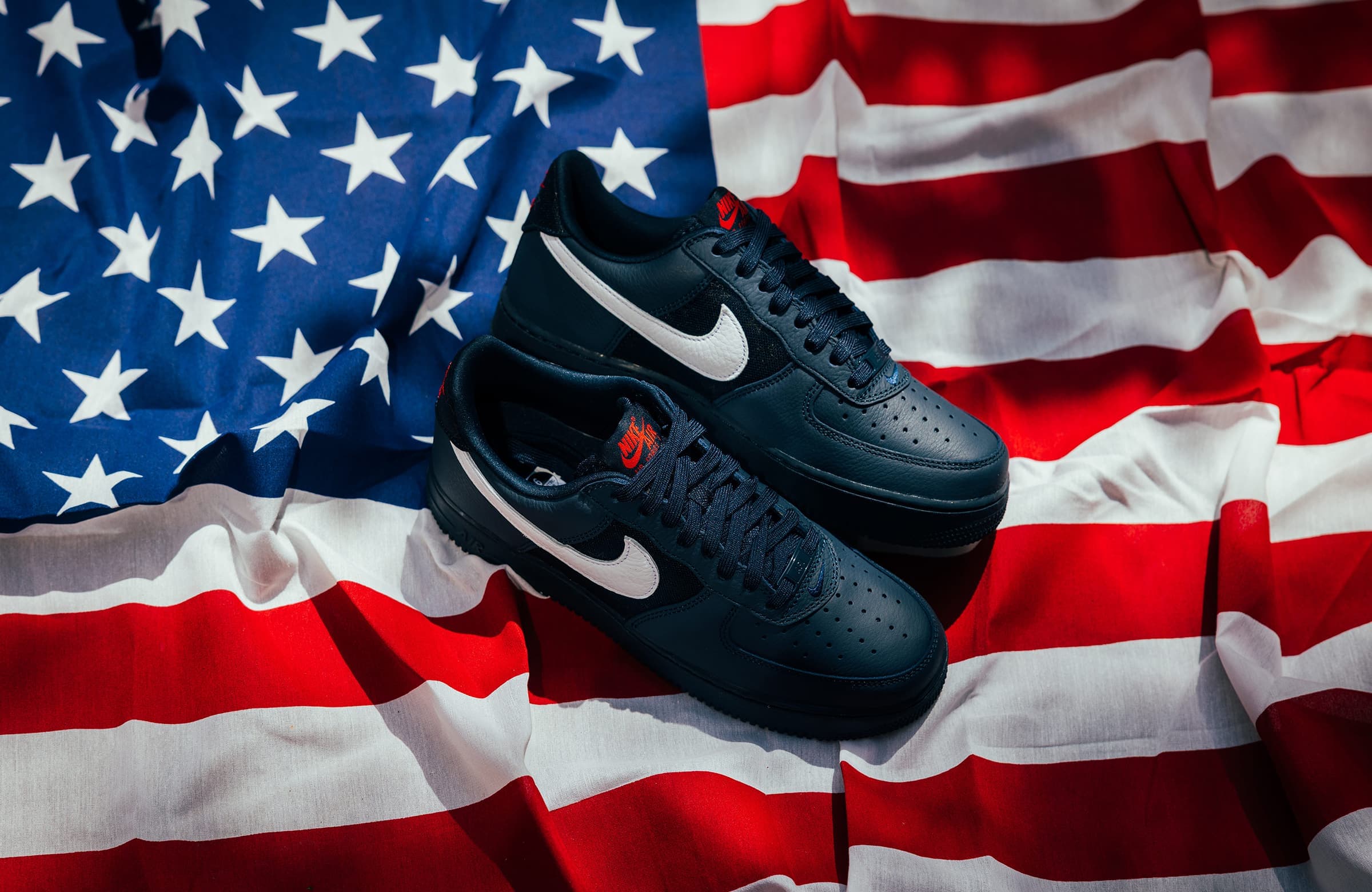 A gallery image from American Life: Black Sneakers Nike Air Force 1 Low With US Flag Under Them