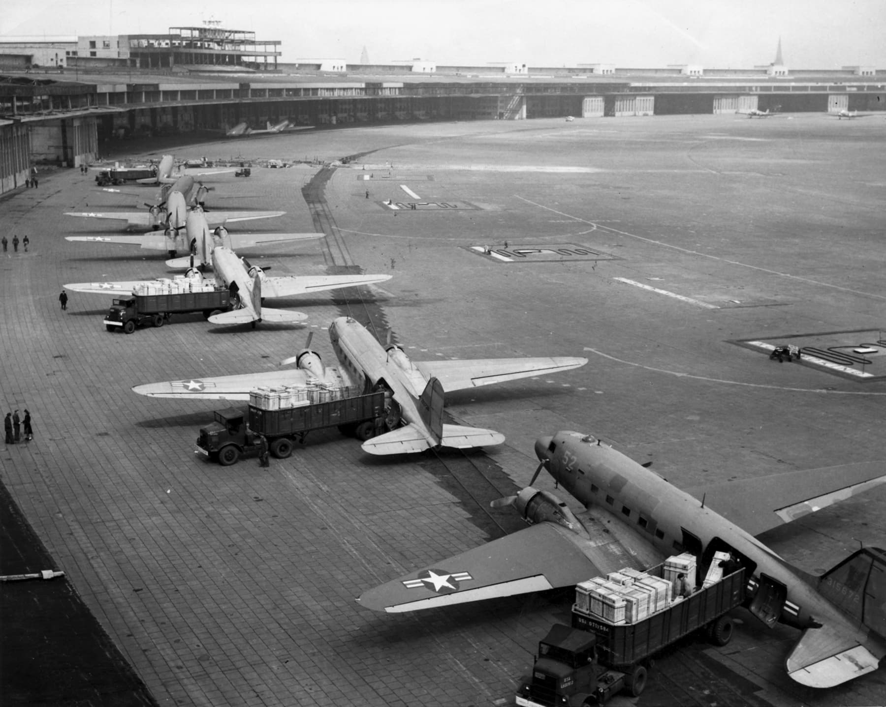 A gallery image from Military: C 47s Unloading During The Berlin Airlift