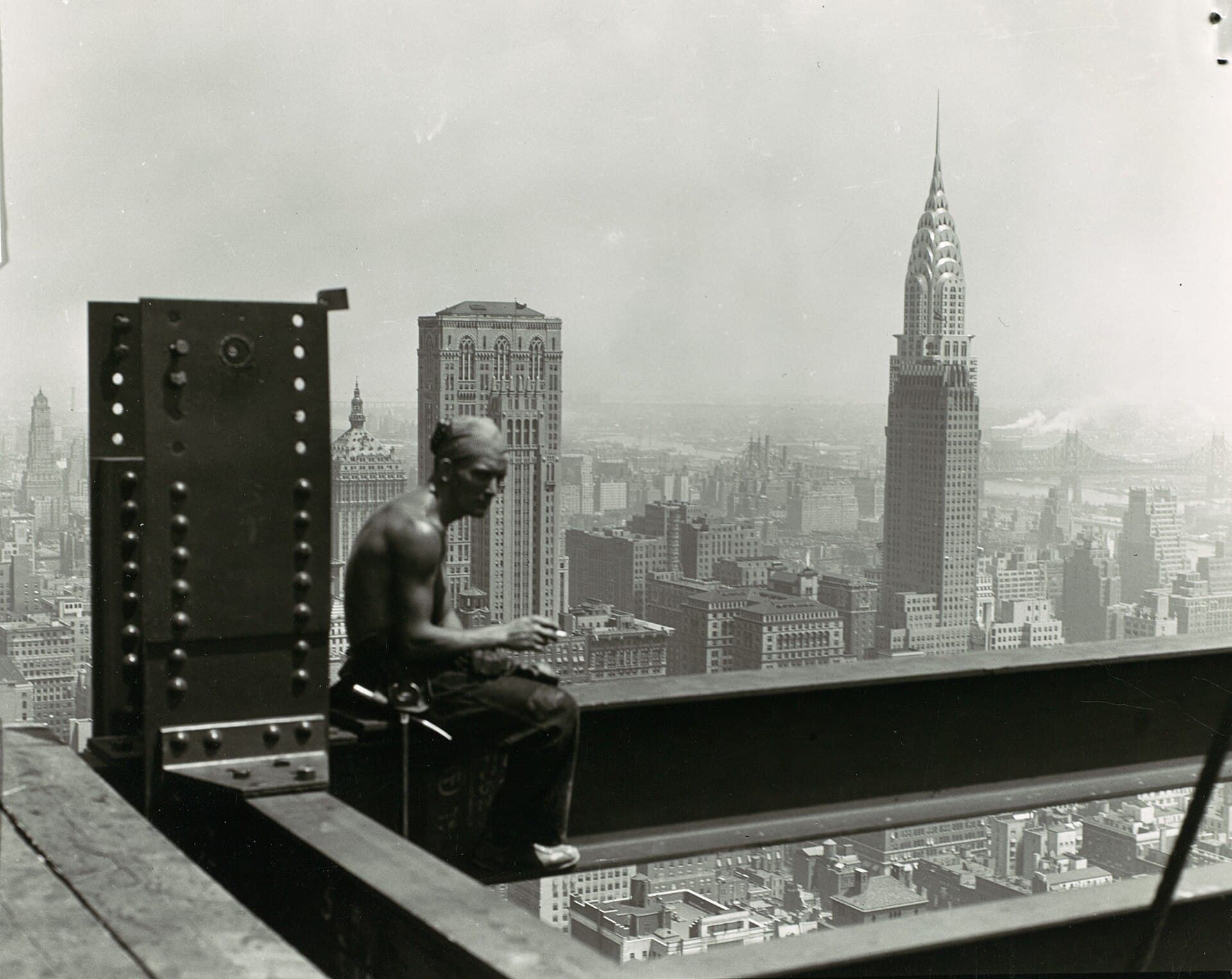 Ironworkers frame the world's tallest building above Manhattan.