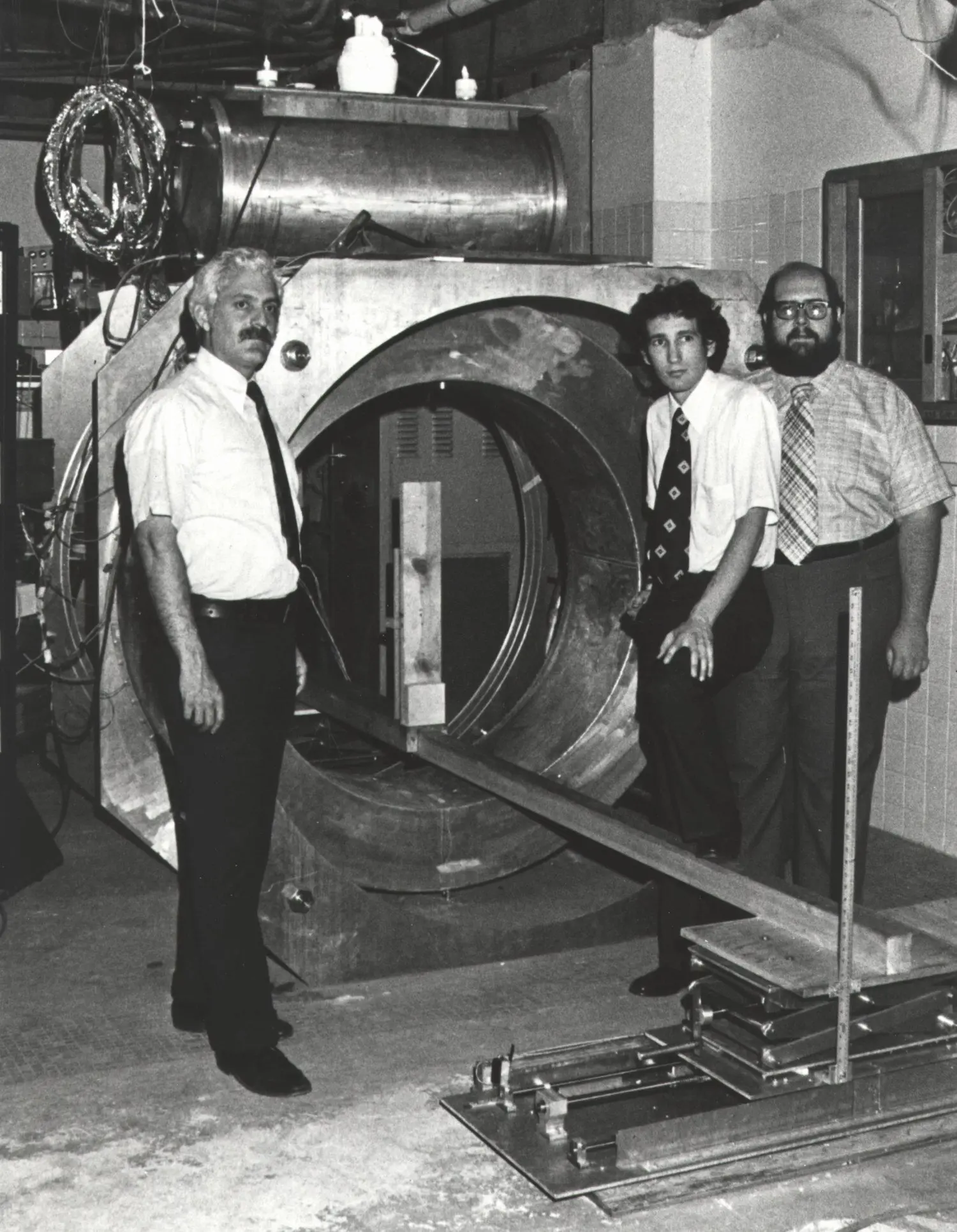 The inventor beside 'Indomitable,' the first MRI machine.