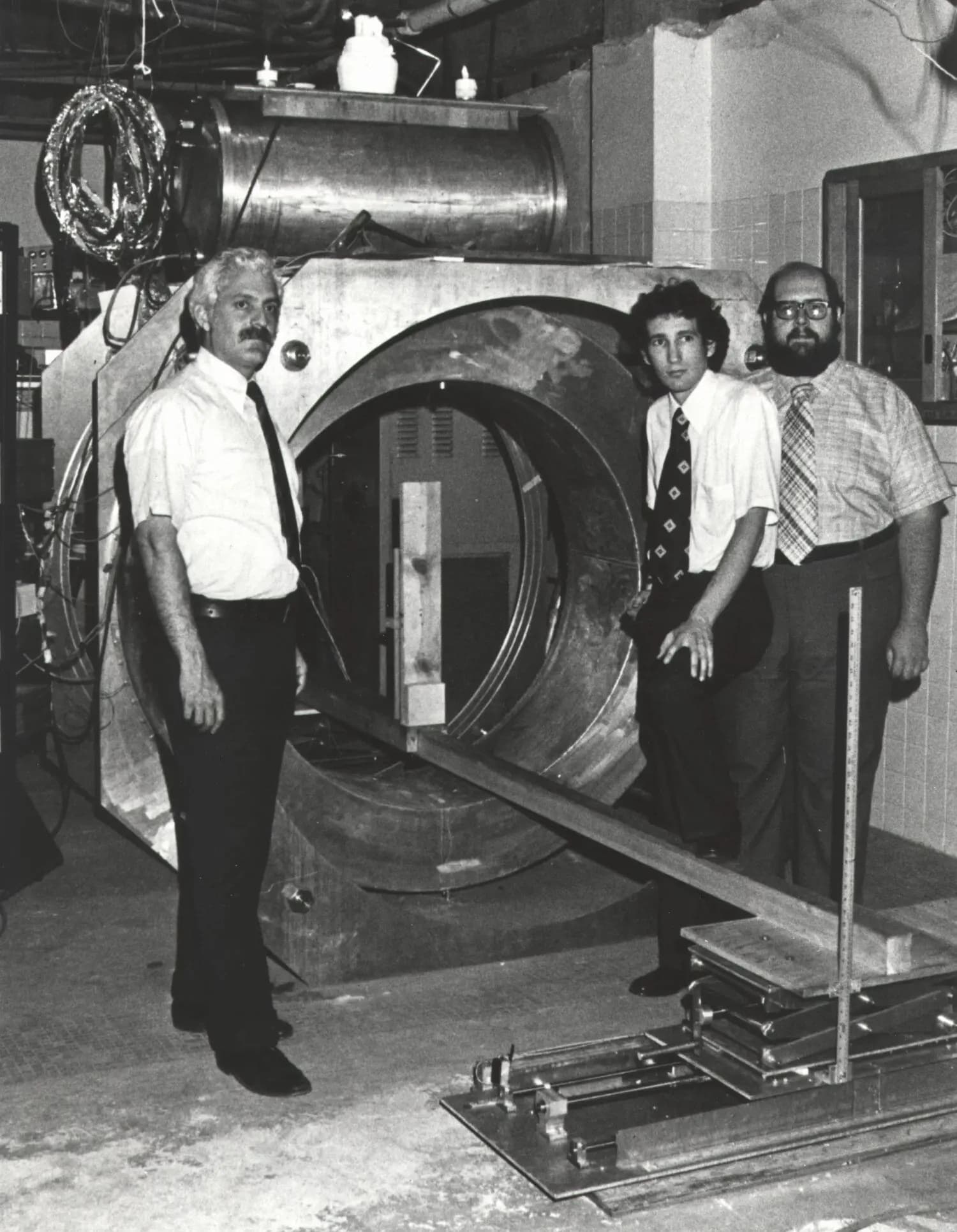 The inventor beside 'Indomitable,' the first MRI machine.