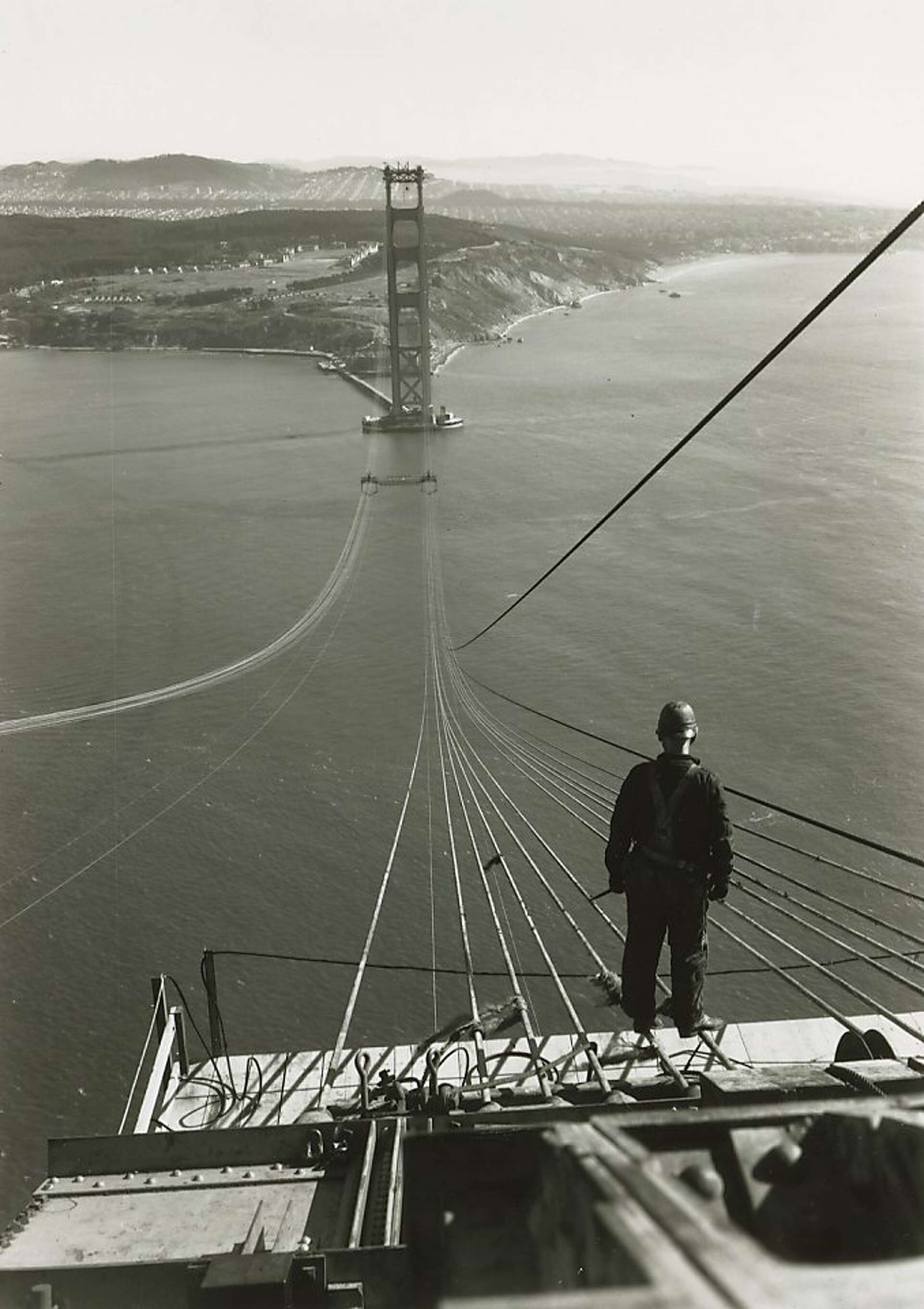 The great suspension span closes over the strait.