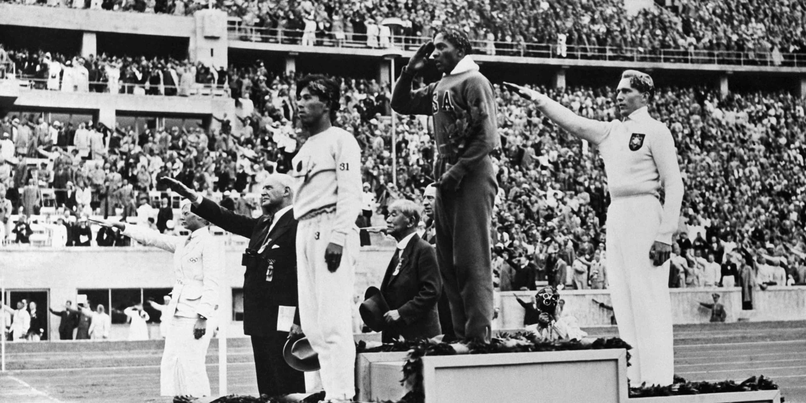 Owens wins four golds before a Nazi crowd.