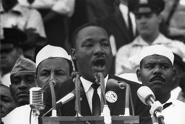 Martin Luther King Jr. delivering the I Have a Dream speech at a bank of microphones