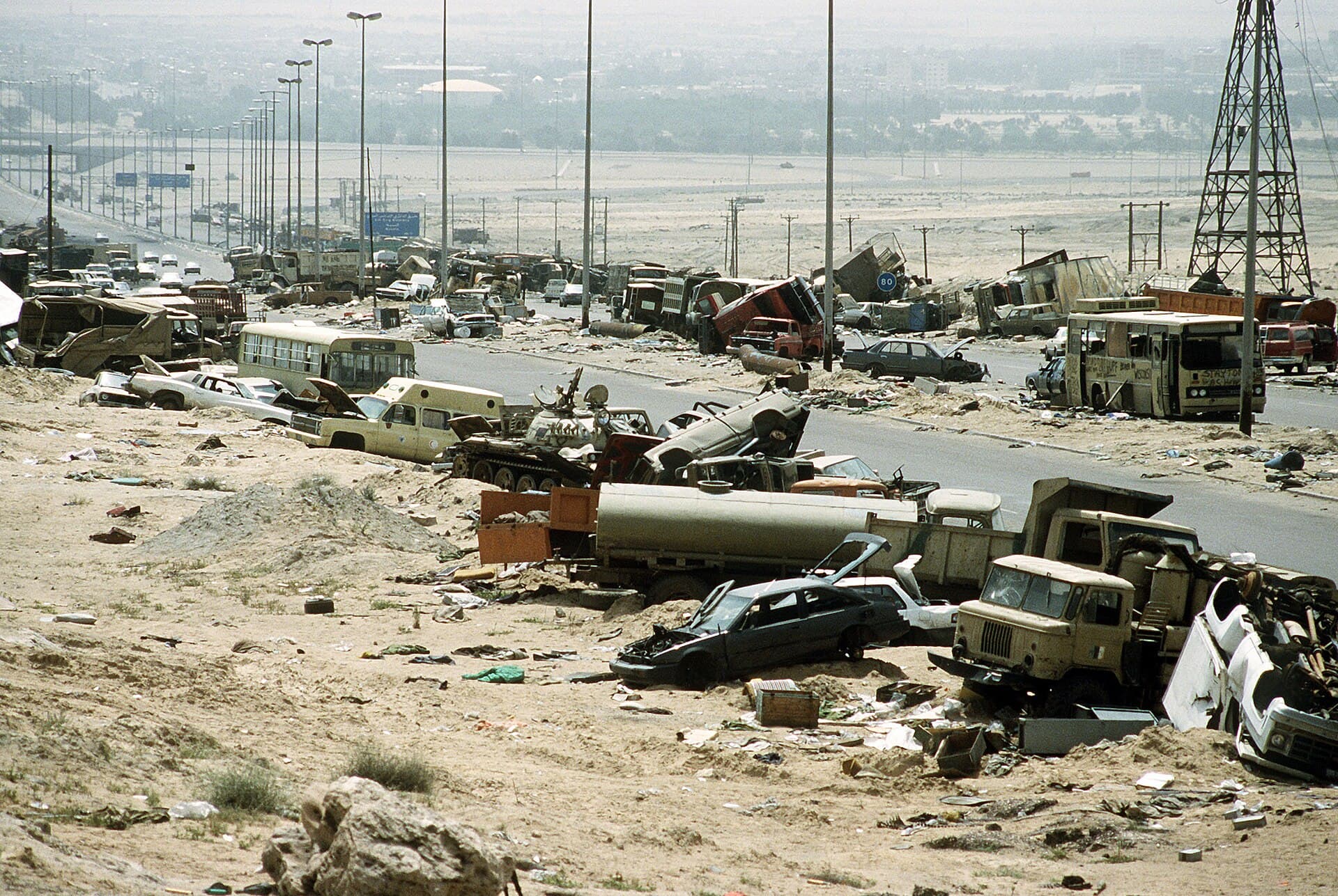 Destroyed military and civilian vehicles strewn along Highway 80 out of Kuwait