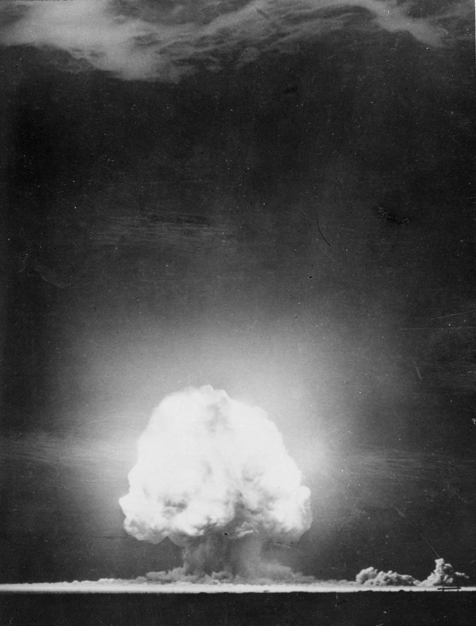 The fireball and mushroom cloud of the first nuclear detonation at the Trinity test