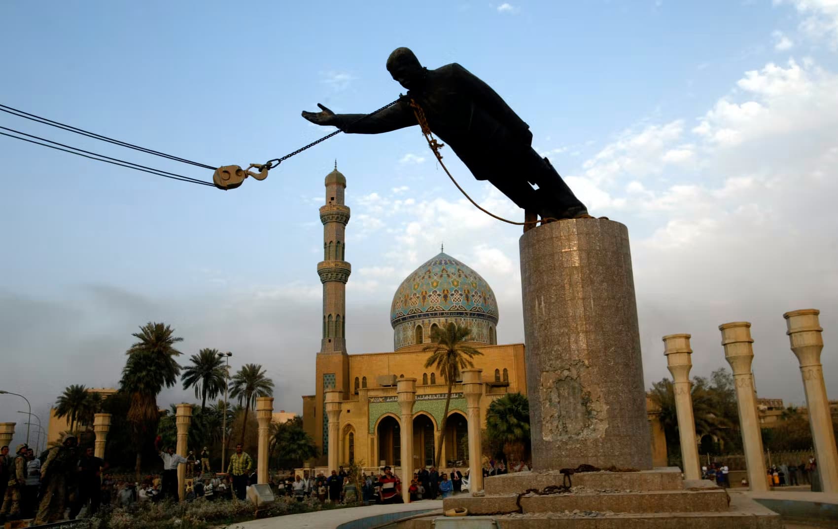 A statue of Saddam Hussein being pulled down in Firdos Square, Baghdad