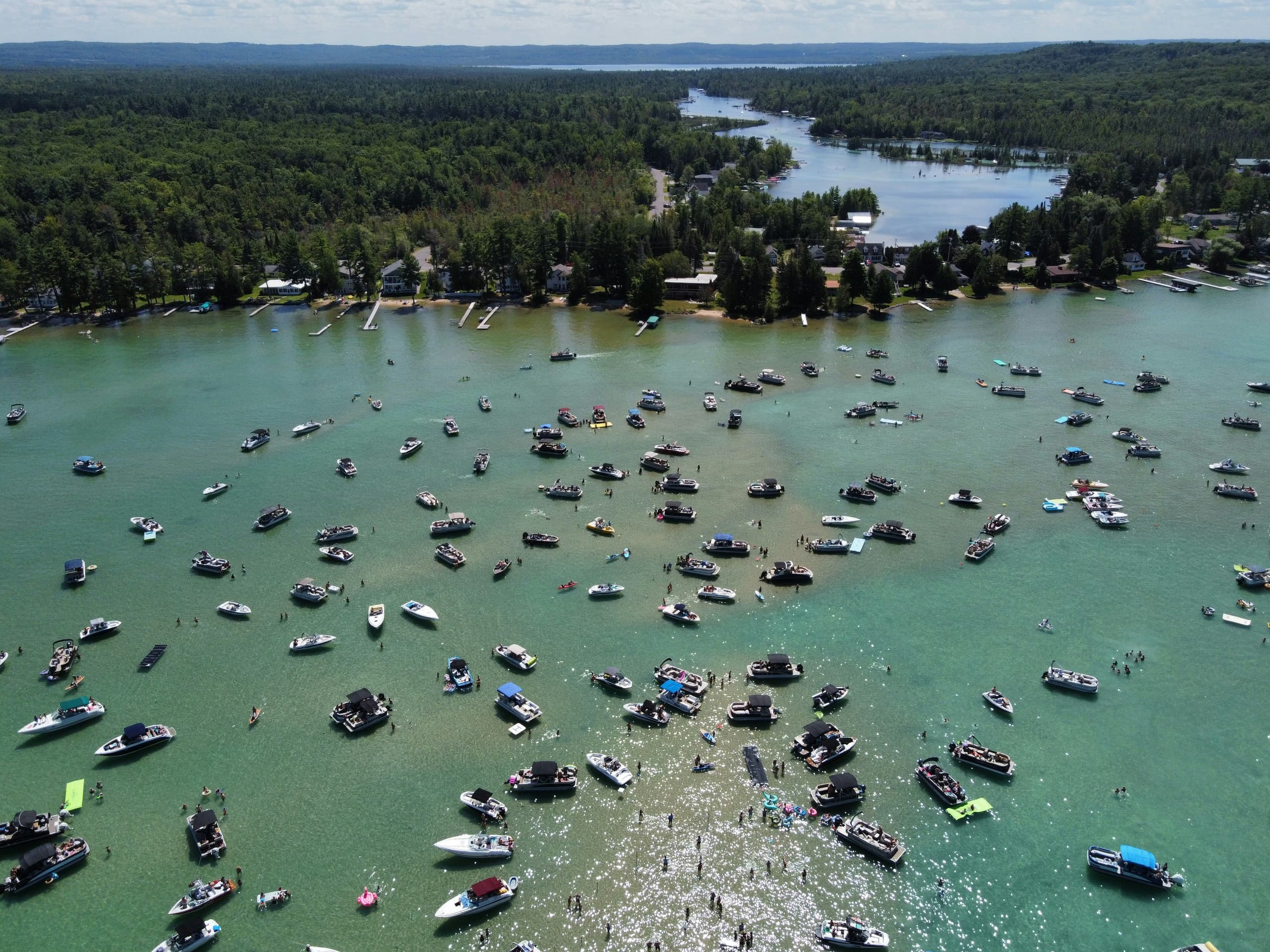 A gallery image from American Life: Torch Lake Sandbar Michigan Lots Of Boats Aerial
