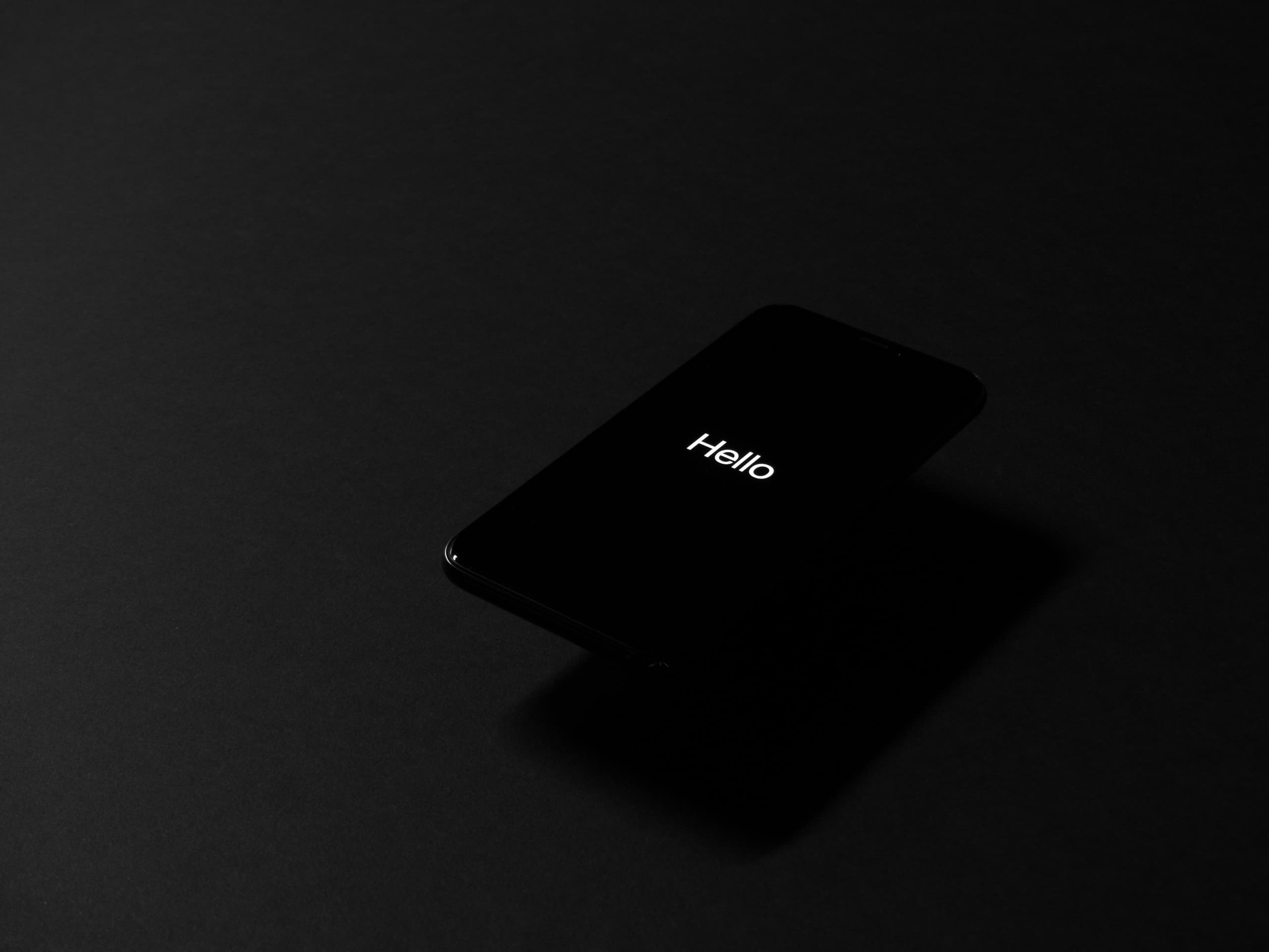 A gallery image from Technology: IPhone Saying Hello On Dark Background