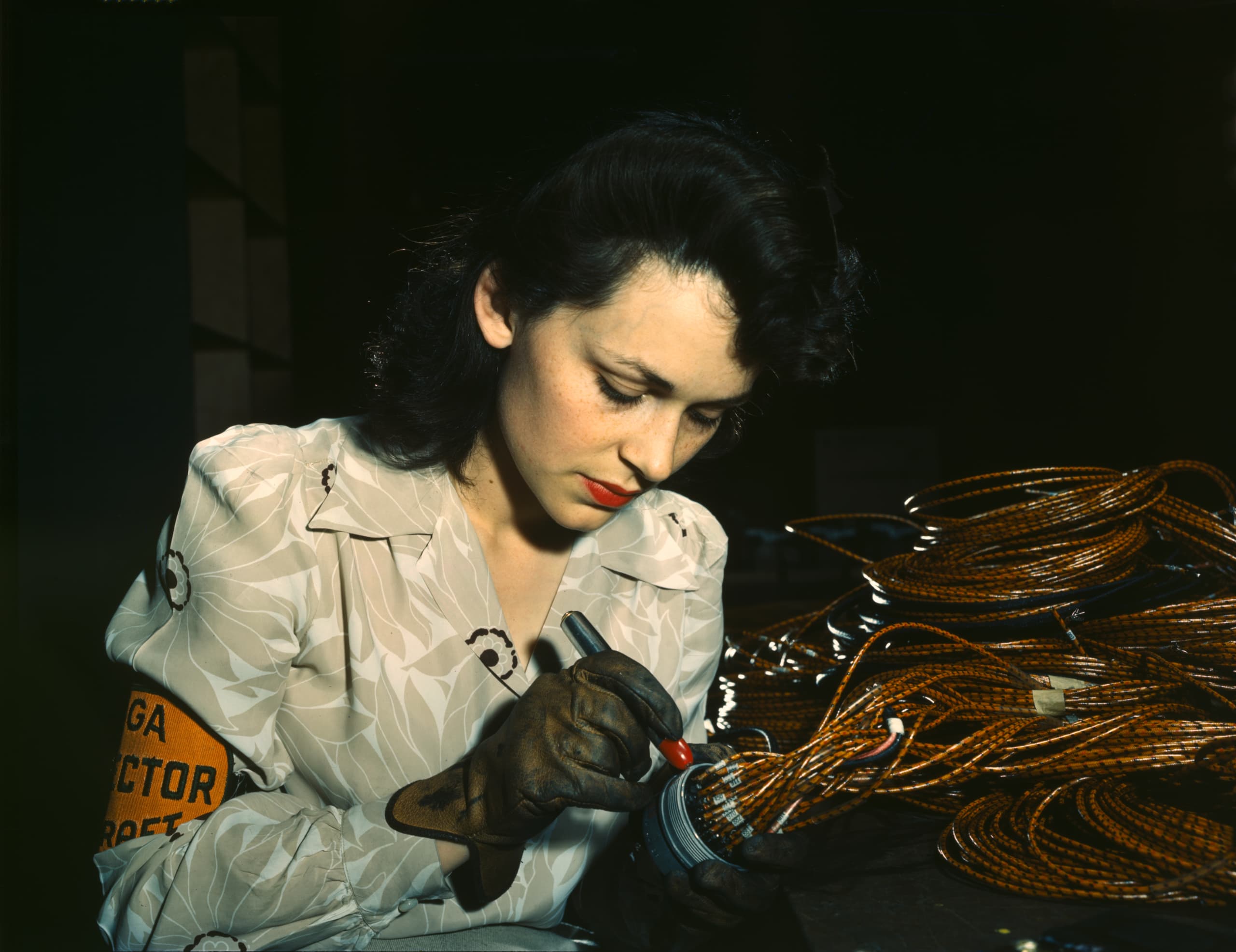 A gallery image from History: Woman Aircraft Worker Checking Assemblies. California, 1942