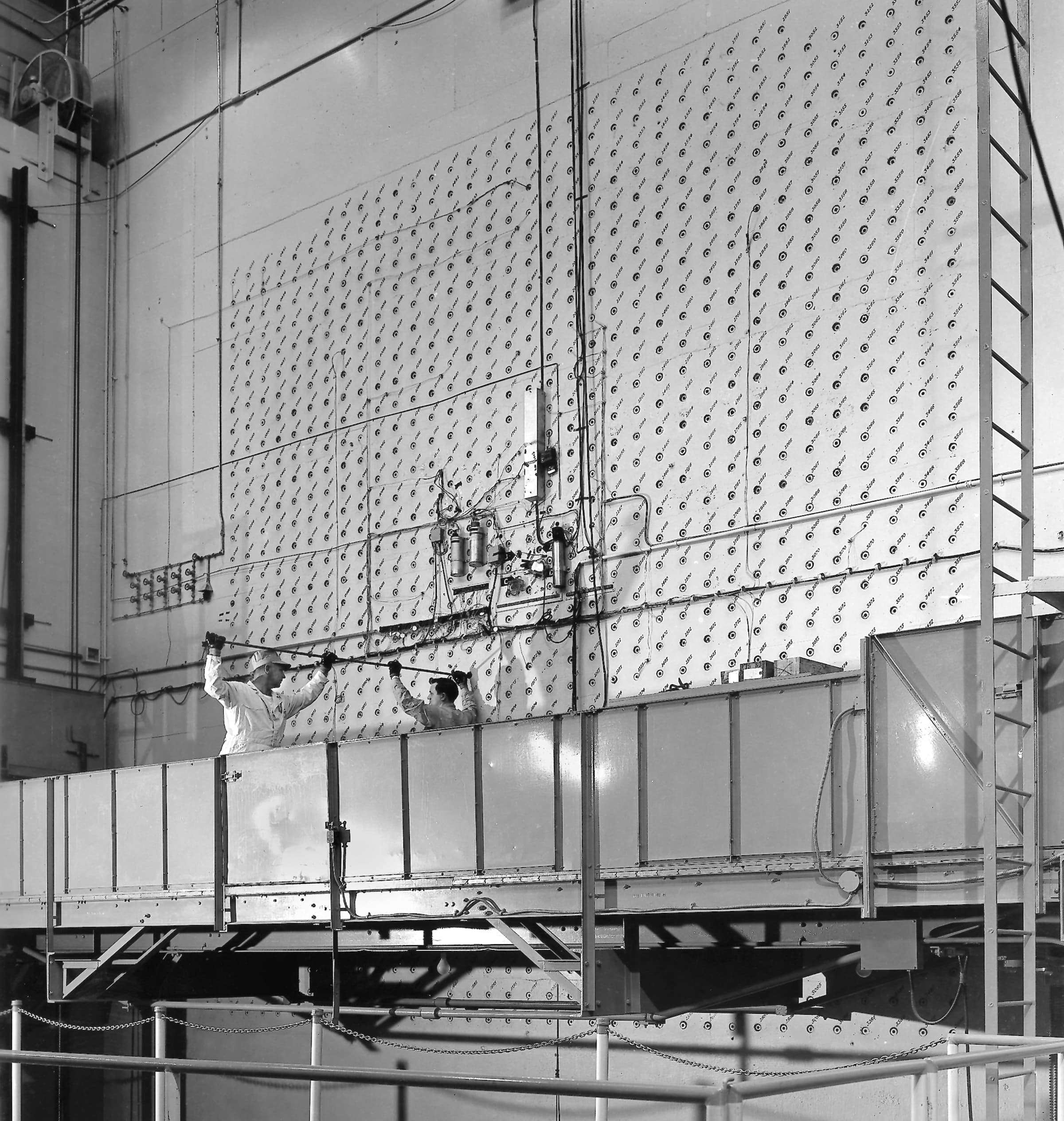 A gallery image from History: Workers Load Uranium Slugs Into The X 10 Graphite Reactor