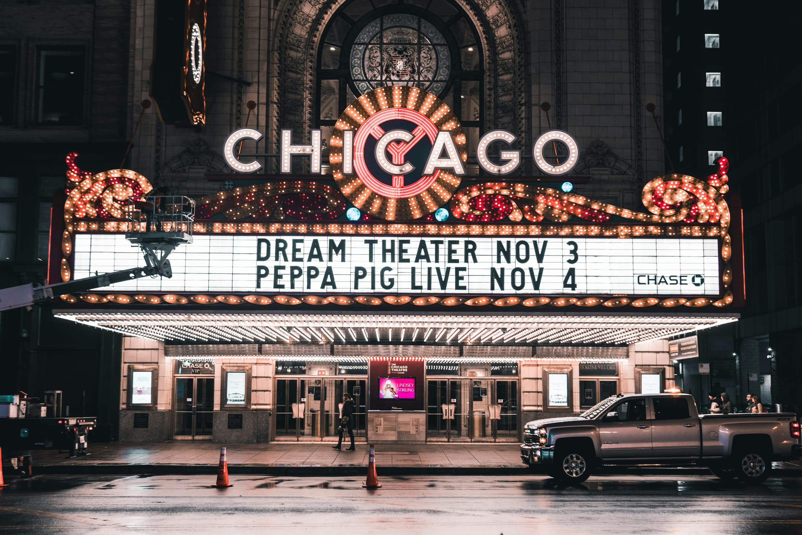 Illuminated Chicago Theatre marquee at night