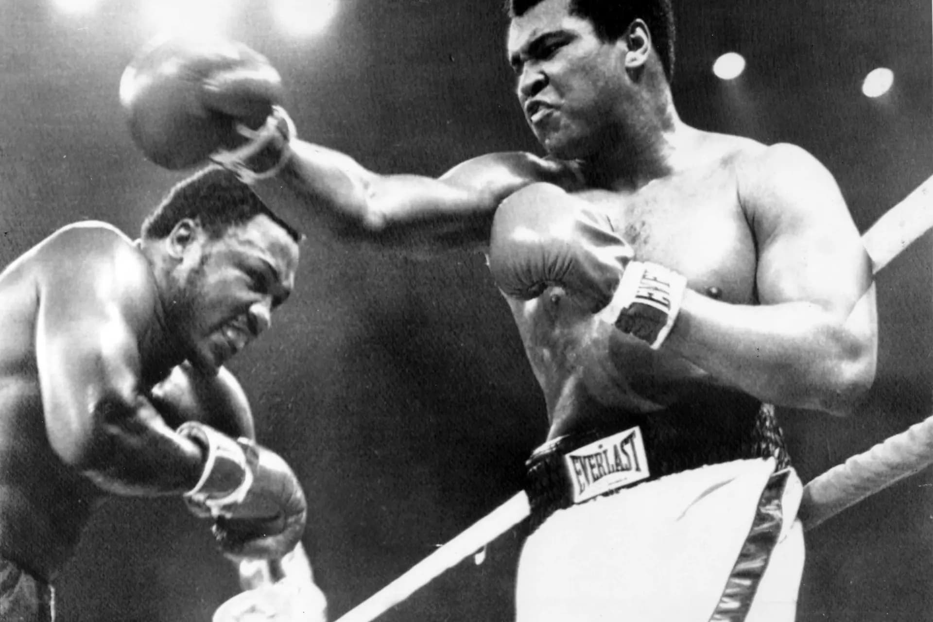 Muhammad Ali landing powerful left jab on Joe Frazier