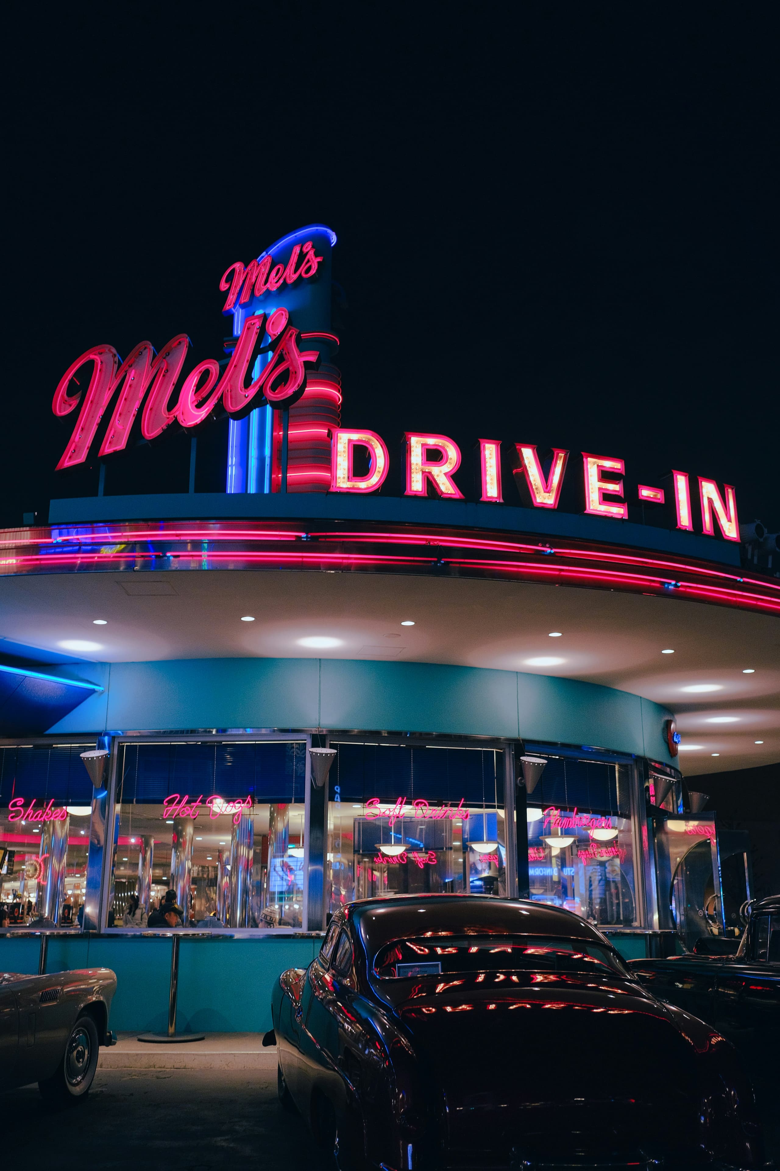Classic car and neon lights reflecting Americana culture
