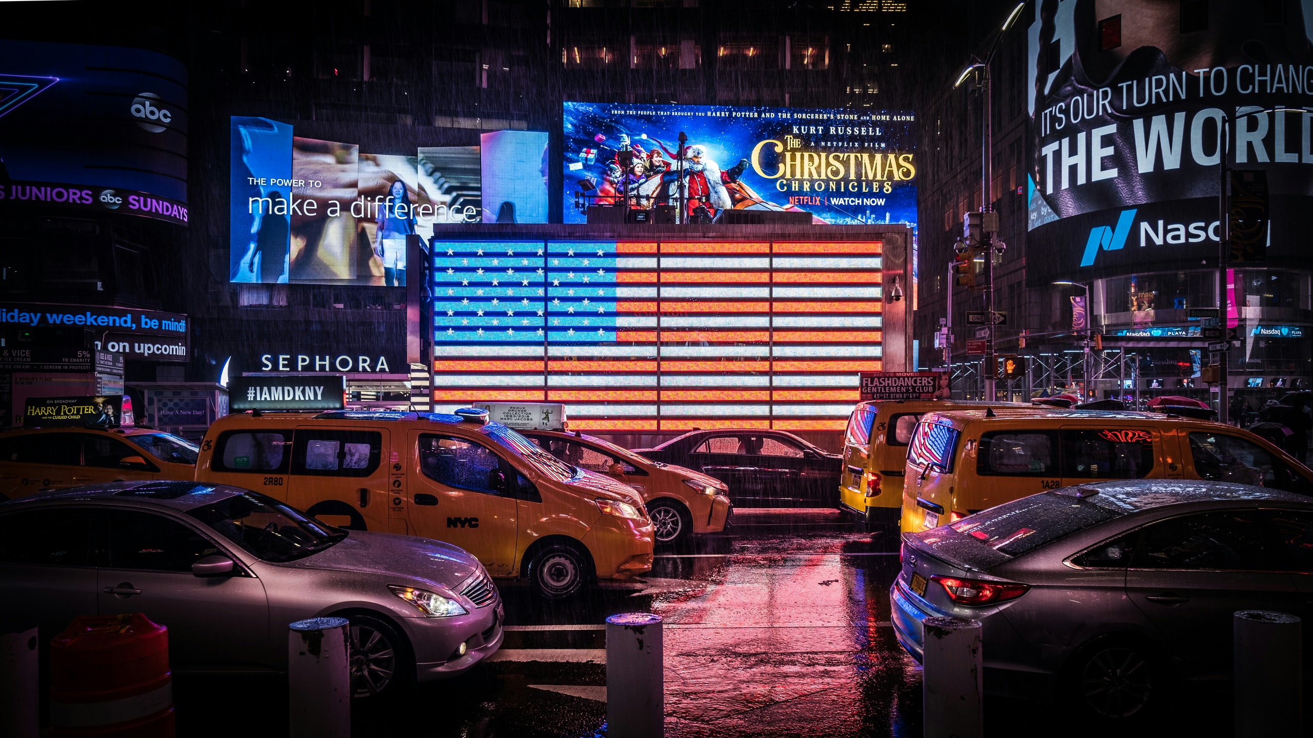 Times Square NYC at night with illuminated signs