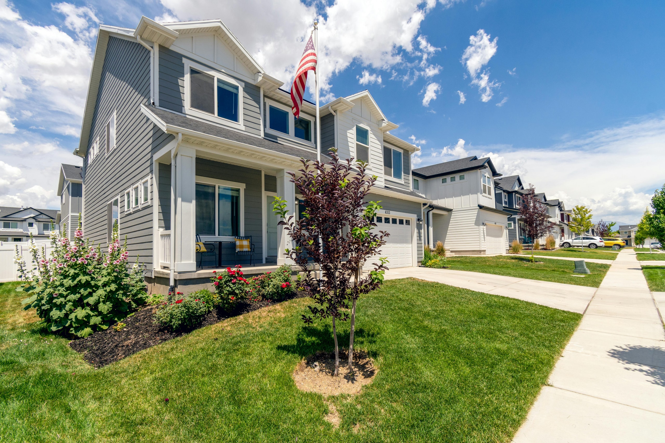 Modern American Suburban Home with American Flag